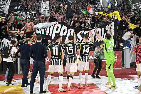 Juventus' players celebrate with fans